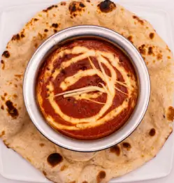 Creamy chicken tikka masala served with naan bread