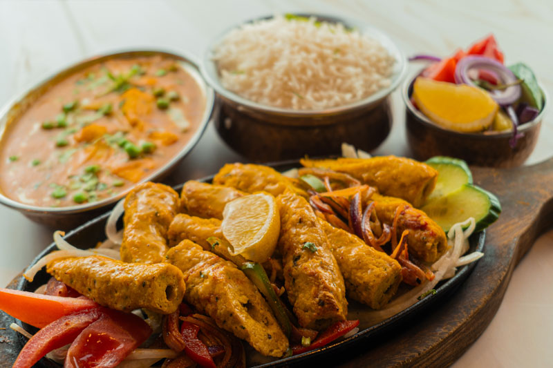 Mixed Indian pakora platter with fritters and chutneys served at Gandhi Restaurant in Amsterdam